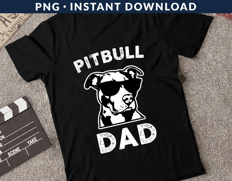 May include: Black t-shirt with a white graphic of a pitbull wearing sunglasses and the text "Pitbull Dad".