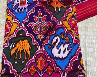 Vibrant Ikat Patola Saree | Handloom Silk, Animal Motif, Geometric Weave, Festive Indian Sari
