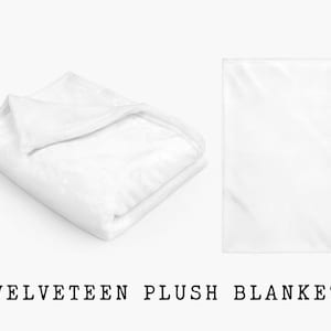 May include: A white, soft, plush blanket folded in half. The blanket is made of a velvety material and is perfect for cuddling up on the couch.