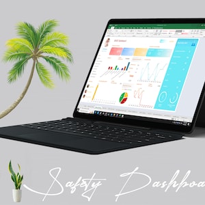 May include: A black laptop with a white keyboard and a bright, colorful spreadsheet open on the screen. The spreadsheet is titled "Safety Dashboard" and contains various charts and graphs. The laptop is sitting on a gray surface with a green palm tree and two potted plants in the background.