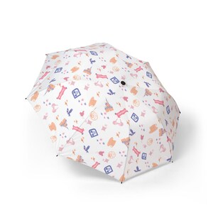 May include: White umbrella with a repeating pattern of castles, birds, stars, and other whimsical shapes in shades of pink, orange, and blue. The umbrella is open and ready for use.