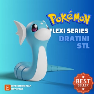 May include: A 3D-printed Dratini figure from the Pokémon Flexi Series, in light blue and white. The figure has a long, serpentine body with a white underbelly and fins. The image includes the Pokémon logo and the text "BEST SELLER".