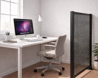 May include: A modern home office setup featuring a white desk with a computer, lamp, and office chair. A black perforated metal room divider stands to the right. The room has a window with a white blind.