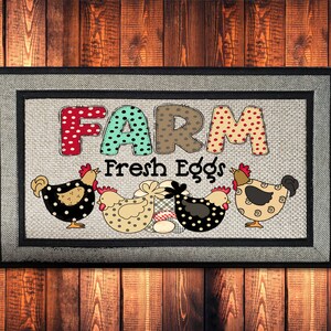 May include: A gray doormat with a black border and the words "FARM Fresh Eggs" in colorful patchwork letters. Four cartoon chickens are depicted on the mat, each with a different color and pattern.