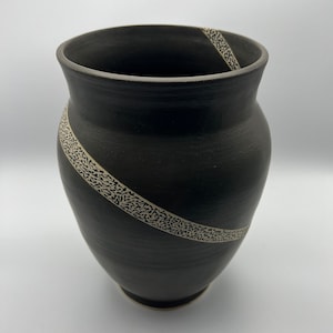 Ceramic vase with decorative hand-painted design
