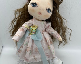 Handmade doll with light pink dress
