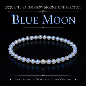 May include: A bracelet featuring round rainbow moonstone beads with a blue iridescent sheen, accented by a single textured silver-toned spherical bead. The text reads: EXQUISITE 8A RAINBOW MOONSTONE BRACELET, BLUE MOON, HANDMADE IN NEWFOUNDLAND CANADA.