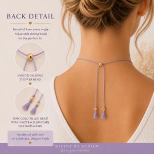 May include: A lavender cord necklace featuring a gold-toned sliding stopper bead and two dangling ends finished with gold-toned beads and small lavender tassels. The text BACK DETAIL, SMOOTH SLIDING STOPPER BEAD, and 3MM GOLD FILLED BEAD are visible.