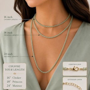 May include: A light green beaded necklace available in 16 inch choker, 18 inch princess, and 24 inch matinee lengths. The necklace features a gold-colored lobster clasp and an extender chain. Text indicates 14K gold filled and sterling silver.
