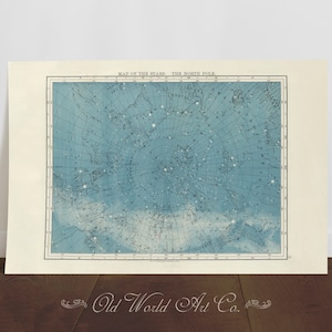 May include: A vintage map of the stars in the Northern Hemisphere, printed on a light blue background with white lines and black text. The map is titled "Map of the Stars, The North Pole".