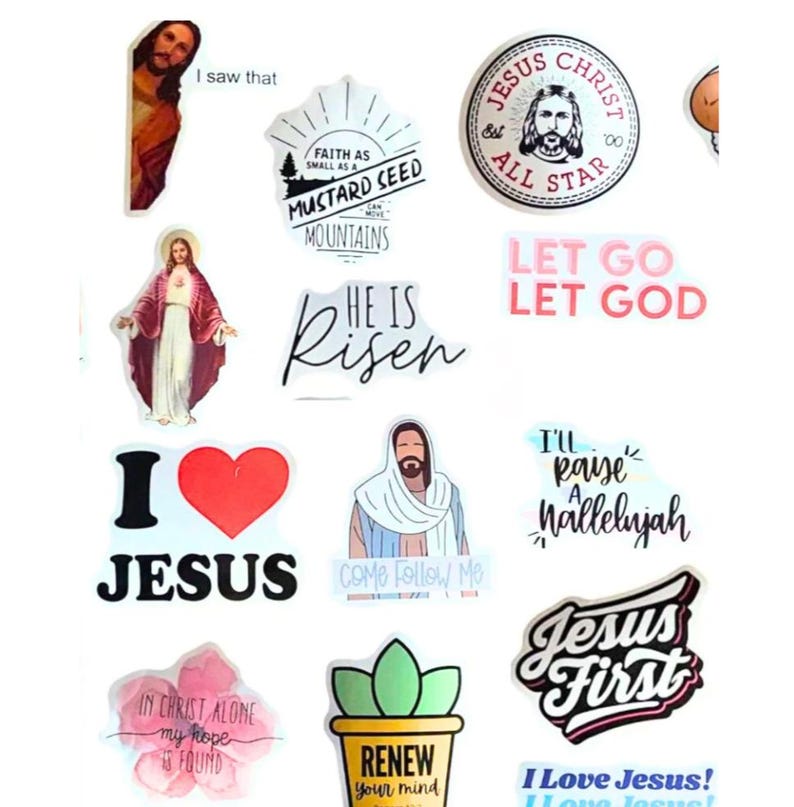 May include: A collection of religious stickers featuring images of Jesus, along with inspirational phrases. The stickers include text such as "I love Jesus", "He is Risen", and "Jesus First". The stickers are in various shapes and sizes.