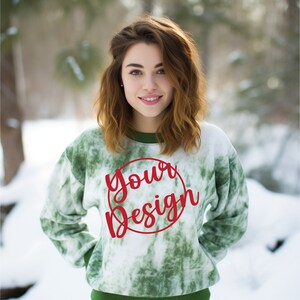 May include: A green and white tie-dye sweatshirt with a red circle and the text "your design" inside the circle.