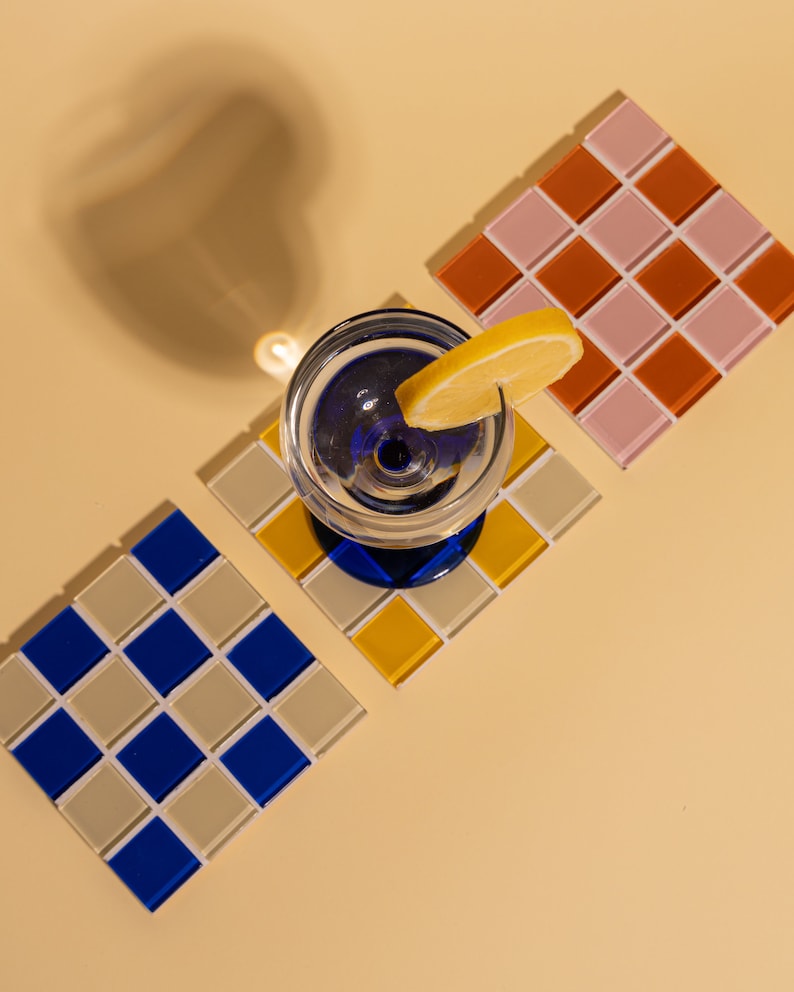 Handcrafted glass mosaic coaster featuring bold colors and a classic square layout—an eye-catching home accessory for kitchen counters, office desks, or coffee tables. This artisanal tile coaster makes a wonderful handmade gift for women who love vibrant decor, and it’s equally perfect as a Christmas gift, birthday surprise, or thoughtful thank-you.