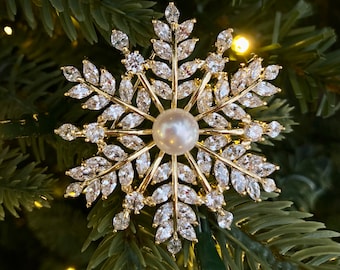 Winter Elegance: Zirconia Snowflake Brooch with White Pearl Accent