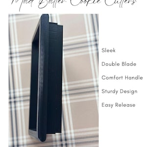 May include: A black cookie cutter with a sleek design, double blade, comfort handle, sturdy construction, and easy release.