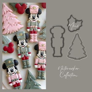 May include: Decorated sugar biscuits shaped like Mickey Mouse nutcrackers and Christmas trees alongside metal biscuit cutters. The biscuits feature pink, red, and sage green icing with gold accents. The text reads Mini Nutcracker Collection.