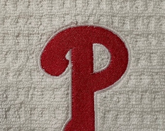May include: Red embroidered letter "P" on a white towel.