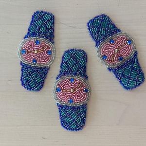 May include: A handmade wooden sign with the text "Welcome" in a playful font. The sign features a distressed finish and a simple, rustic design, perfect for a front door or entryway. It is likely intended for home decor.