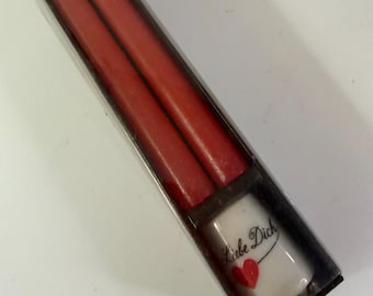 Vintage German ceramic candlestick Holder with “Ich Liebe Dich” on it and a red heart and two red taper candles in original box. 1980s?