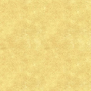 May include: A close-up of a fabric with a repeating pattern of small, light brown dots arranged in a honeycomb design on a yellow background. The fabric has a textured appearance, with the dots creating a subtle, geometric effect.