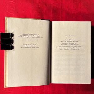 May include: A close-up of the copyright and dedication pages of a book titled "Roots" by Alex Haley. The copyright page states that the work first appeared in Reader's Digest. The dedication page reads: "It wasn't planned that "Roots" would take another year, finally encountering and writing just by chance it is being published in the Bicentennial Year of the United States. So I dedicate "Roots" as a birthday offering to my country, within which most of "Roots" happened."