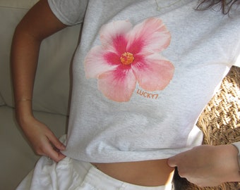 T-shirt bébé rose à imprimé d'hibiscus