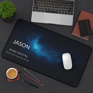 May include: Black rectangular mouse pad with a starry sky design and the name "JASON" in white. The text "Stellar Serenity" and "Where calm meets the infinite" are also displayed. A white mouse sits on the pad.