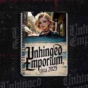 Puede incluir: Un cuaderno de espiral con una ilustración de una mujer rubia. La portada muestra el texto "Unhinged Emporium, circa 2025" sobre un fondo de vetas de madera azul y blanca.