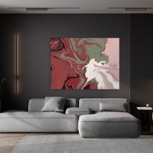 May include: A modern living room with a gray sectional sofa, a gray armchair, and a large abstract painting with red, white, and green swirls. The room has dark gray walls and wood floors.