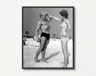 Man Showing Muscles to a Woman at the Beach, Vintage Black and White Photograph Print, Beach Lover Gift, Summer Gift, Old Summer Photograph