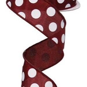 May include: A roll of 2.5 inch wide burgundy ribbon with white polka dots.