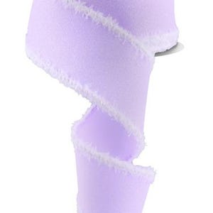 May include: A roll of lavender ribbon with a white frayed edge. The ribbon is curled and has a white label on the spool.