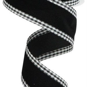 May include: Black velvet ribbon with white and black gingham trim. The ribbon is 2.5 inches wide.