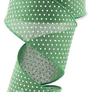 May include: Green wired ribbon with white polka dots. The ribbon is 2.5 inches wide.