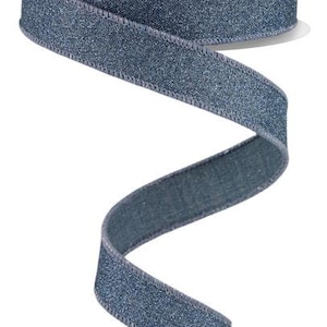 May include: A roll of blue glitter ribbon with a satin finish. The ribbon is curled and twisted, showing off its shimmery texture.