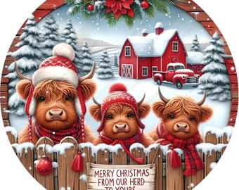 May include: Three Highland cows wearing red Santa hats and scarves stand in front of a wooden fence with snow on top. A red barn with a white roof is in the background. The sign on the fence reads "Merry Christmas from our herd to yours".