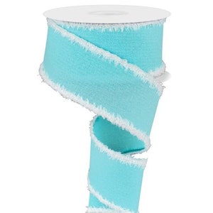 May include: A light blue ribbon with a white frayed edge. The ribbon is curled and twisted, showing off the texture of the fabric.