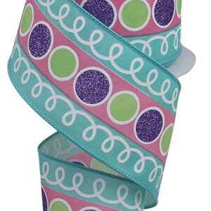 May include: Teal ribbon with a pink, green, and purple polka dot pattern. The ribbon has a white swirl design.