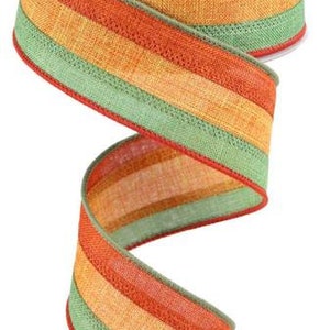 May include: A 2.5 inch wide striped ribbon with orange, yellow, and green stripes. The ribbon is made of a textured fabric and has a wired edge.