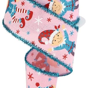May include: Pink ribbon with a white background and a blue glitter edge. The ribbon features a repeating pattern of elves wearing red and blue hats and holding candy canes. The elves are smiling and have white beards.