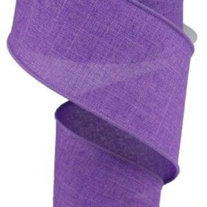 May include: A roll of purple, textured, wired ribbon. The ribbon is 2.5 inches wide and has a linen-like texture.