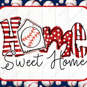 May include: A red, white, and blue sign with the words "Home Sweet Home" in black script. The sign is decorated with baseballs and a baseball-themed design.