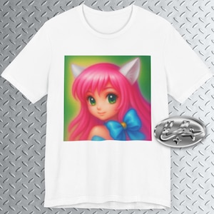 May include: White t-shirt featuring a colorful anime-style illustration of a girl with pink hair, cat ears, and a blue bow. The artwork has a green background. A silver emblem is on the right.