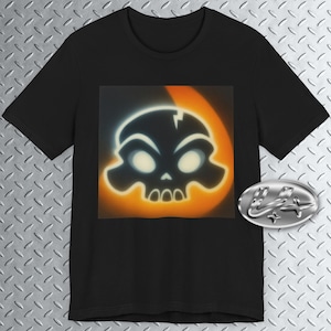 May include: Black t-shirt featuring a cartoon skull design with a white outline and orange background. The skull has glowing eyes and a crack on top. A silver emblem is on the right side of the shirt.