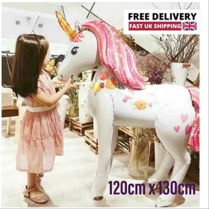 May include: A large white unicorn balloon with pink and white mane and tail. The balloon has a floral pattern and pink hearts. The balloon is 120cm x 130cm.