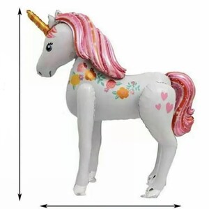 May include: A white unicorn balloon with pink and gold accents. The unicorn has a floral design on its side and pink hearts on its rear end.