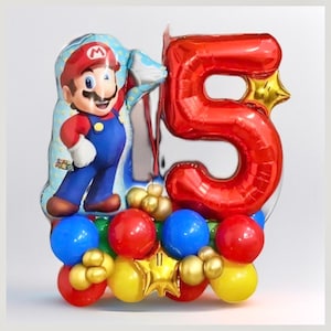 May include: A red number 5 balloon with a gold star, a red and blue Mario character balloon, and a cluster of red, blue, yellow, and gold balloons.