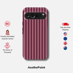 May include: A burgundy and pink striped phone case. The case has a camera aperture and the text "AesthePoint" at the bottom. The case is designed to protect the phone. The stripes are vertical.