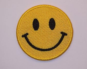 ウォッチメンのシンボル - アイロンで貼る刺繍入りスマイリーフェイス