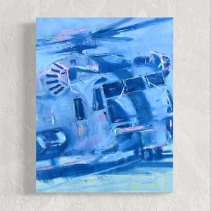 May include: Abstract painting of a helicopter in shades of blue with pink and green accents. The artwork features a dynamic composition with visible brushstrokes, creating a sense of movement and depth. The painting is mounted on a white surface.